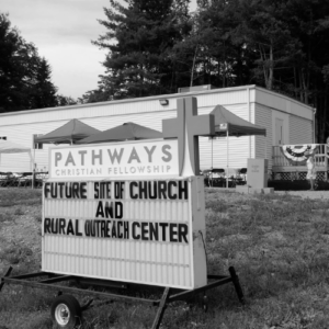Pathways sign in front of ROC FEMA trailer that says "Future site of church and Rural Outreach Center"